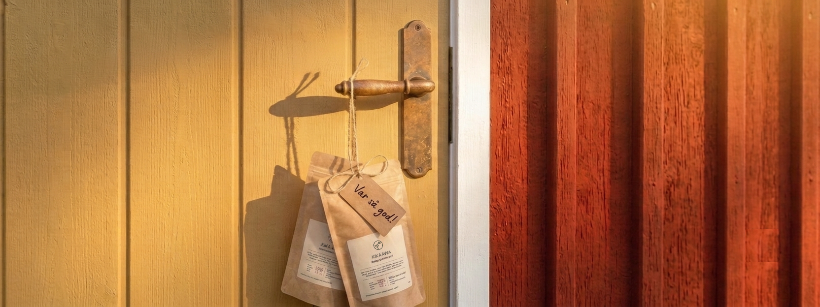 Just Coffee bags hanging on a sunny yellow door